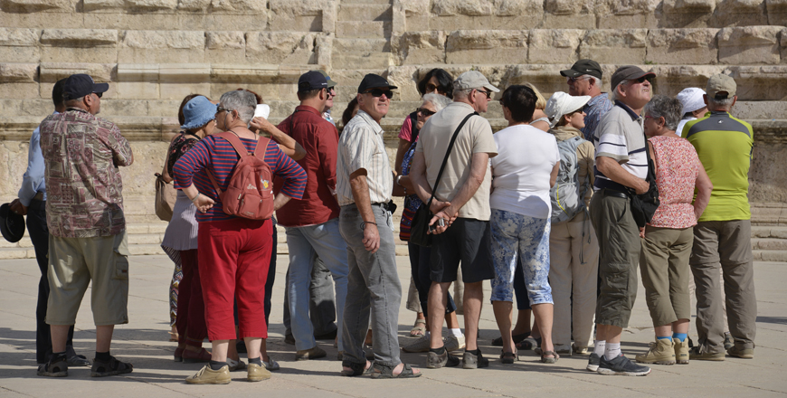 Tourists visit the Roman Theatre in downtown Amman recently (Photo by Amjad Ghsoun)